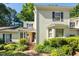 Charming two-story home with a landscaped front yard and inviting entryway at 411 Brampton Close, Pittsboro, NC 27312