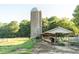 Idyllic farm scene with grazing cattle near a silo and sheltered area at 411 Brampton Close, Pittsboro, NC 27312