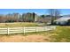 Expansive farm with white fencing, grazing livestock, and a large silo at 411 Brampton Close, Pittsboro, NC 27312