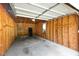Empty garage with a concrete floor and unfinished wood walls at 411 Brampton Close, Pittsboro, NC 27312