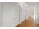Bright hallway with closet storage and stairs, offering a welcoming entrance at 411 Brampton Close, Pittsboro, NC 27312