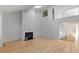 Bright living room with hardwood floors, fireplace, and skylight at 411 Brampton Close, Pittsboro, NC 27312