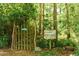 Woodland Garden entrance with lush greenery, and signage at 411 Brampton Close, Pittsboro, NC 27312