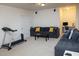 Spacious finished basement with comfortable seating area and workstation at 4355 Pond Pine Trl, Morrisville, NC 27560