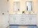 Bathroom with double sink vanity, white cabinets and framed mirrors at 4355 Pond Pine Trl, Morrisville, NC 27560