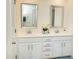 Bright bathroom with double sink vanity, framed mirrors, white cabinetry, and chrome fixtures at 4355 Pond Pine Trl, Morrisville, NC 27560