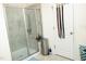 Modern bathroom featuring a glass enclosed shower with tiled walls and storage space at 4355 Pond Pine Trl, Morrisville, NC 27560