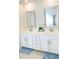 Bathroom vanity with double sinks, modern mirrors, white cabinets and plenty of storage space at 4355 Pond Pine Trl, Morrisville, NC 27560