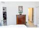 Spacious bedroom with a dresser and a view of the office and bathroom at 4355 Pond Pine Trl, Morrisville, NC 27560