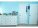 Bright bedroom featuring a white dresser and soothing blue walls for a calm and inviting atmosphere at 4355 Pond Pine Trl, Morrisville, NC 27560
