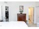 Spacious bedroom with a dresser and a view of the office and bathroom at 4355 Pond Pine Trl, Morrisville, NC 27560