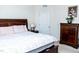 Inviting bedroom featuring a queen bed, dresser, and warm, ambient lighting at 4355 Pond Pine Trl, Morrisville, NC 27560
