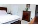 Inviting bedroom featuring a queen bed, dresser, and warm, ambient lighting at 4355 Pond Pine Trl, Morrisville, NC 27560