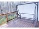 Outdoor deck features a wooden swing and views of the surrounding woods at 4355 Pond Pine Trl, Morrisville, NC 27560