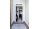 Welcoming foyer with a view into the dining area, showcasing hardwood floors and neutral decor at 4355 Pond Pine Trl, Morrisville, NC 27560