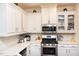 Well-equipped kitchen featuring stainless steel appliances, quartz countertops, and ample cabinet space at 4355 Pond Pine Trl, Morrisville, NC 27560