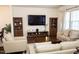 Bright living area with cozy seating, entertainment center, and lots of natural light at 4355 Pond Pine Trl, Morrisville, NC 27560