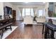 Open living space with comfortable seating and view of kitchen area at 4355 Pond Pine Trl, Morrisville, NC 27560