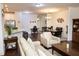 Open concept living room and dining area with hardwood floors and stylish decor, perfect for entertaining at 4355 Pond Pine Trl, Morrisville, NC 27560