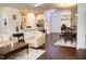 Bright living room with hardwood floors, open to the kitchen and dining area; perfect for modern living at 4355 Pond Pine Trl, Morrisville, NC 27560