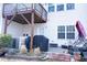 Back patio with overhead deck, grill, and potential for landscaping at 4355 Pond Pine Trl, Morrisville, NC 27560