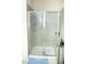 Bathroom shower with glass doors, tiled walls, seat and chrome shower head at 4355 Pond Pine Trl, Morrisville, NC 27560