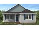 Charming one-story home featuring a classic blue front door, gray siding and blue shutters at 4454 Poppy Mallow Ln, Oxford, NC 27565