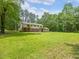 Expansive backyard with a stone fire pit area at 4508 Old Us 421 N N, Siler City, NC 27344