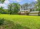 Sprawling backyard with stone fire pit, perfect for outdoor entertaining at 4508 Old Us 421 N N, Siler City, NC 27344