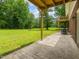 Open backyard with large grassy area, exterior deck, and mature trees at 4508 Old Us 421 N N, Siler City, NC 27344