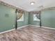 Bedroom with hardwood floors, neutral walls, and two windows at 4508 Old Us 421 N N, Siler City, NC 27344