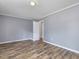 This bedroom features gray walls, wood-look flooring, and white trim at 4508 Old Us 421 N N, Siler City, NC 27344