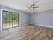 Bedroom featuring neutral walls, ceiling fan, and sliding glass doors to deck at 4508 Old Us 421 N N, Siler City, NC 27344