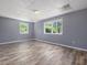 Empty bedroom with hardwood floors, neutral walls, and two windows at 4508 Old Us 421 N N, Siler City, NC 27344
