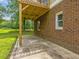 Brick home exterior with concrete patio and wood deck overlooking yard at 4508 Old Us 421 N N, Siler City, NC 27344