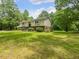Charming two-story home with a landscaped front yard and mature trees at 4508 Old Us 421 N N, Siler City, NC 27344