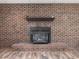 This fireplace features a brick surround and a decorative mantle at 4508 Old Us 421 N N, Siler City, NC 27344