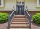 Elegant front entrance with brick steps and a decorative door with sidelights and sconces at 4508 Old Us 421 N N, Siler City, NC 27344
