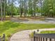 View of the large front yard and driveway bordered by mature trees at 4508 Old Us 421 N N, Siler City, NC 27344