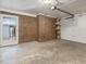 Spacious garage with brick accent wall and access to the home's interior at 4508 Old Us 421 N N, Siler City, NC 27344