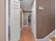 Hallway with tile floors, neutral colored walls, and white doors at 4508 Old Us 421 N N, Siler City, NC 27344