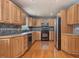 Functional kitchen with wood cabinets, sleek appliances, and a stylish backsplash at 4508 Old Us 421 N N, Siler City, NC 27344