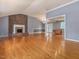 Inviting living room with brick fireplace, hardwood floors, and abundant natural light at 4508 Old Us 421 N N, Siler City, NC 27344