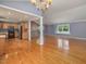 Open concept living room and kitchen featuring hardwood floors and natural light at 4508 Old Us 421 N N, Siler City, NC 27344