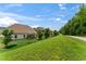 View of a home's backyard and patio space from an elevated perspective, showcasing the outdoor living area at 4907 Sleepy Falls Run, Knightdale, NC 27545