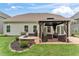 Inviting backyard with a stone fire pit, cozy gazebo, lush lawn, and outdoor entertaining space at 4907 Sleepy Falls Run, Knightdale, NC 27545