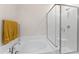 Bright bathroom features a soaking tub with shower and glass enclosure, plus a towel warmer at 4907 Sleepy Falls Run, Knightdale, NC 27545