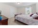 Bedroom with natural light, double closets, and wood furnishings at 4907 Sleepy Falls Run, Knightdale, NC 27545