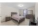 Bedroom with carpet, neutral walls, and dark wood furnishings at 4907 Sleepy Falls Run, Knightdale, NC 27545