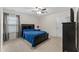 Bedroom with ceiling fan, neutral carpet, and dark wood furniture at 4907 Sleepy Falls Run, Knightdale, NC 27545